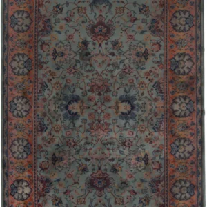 Teppich BID Old Green mit blaugrünem Mittelfeld, ornamentalem Muster in Rot und Dunkelblau sowie orangerotem Bordürenmuster.